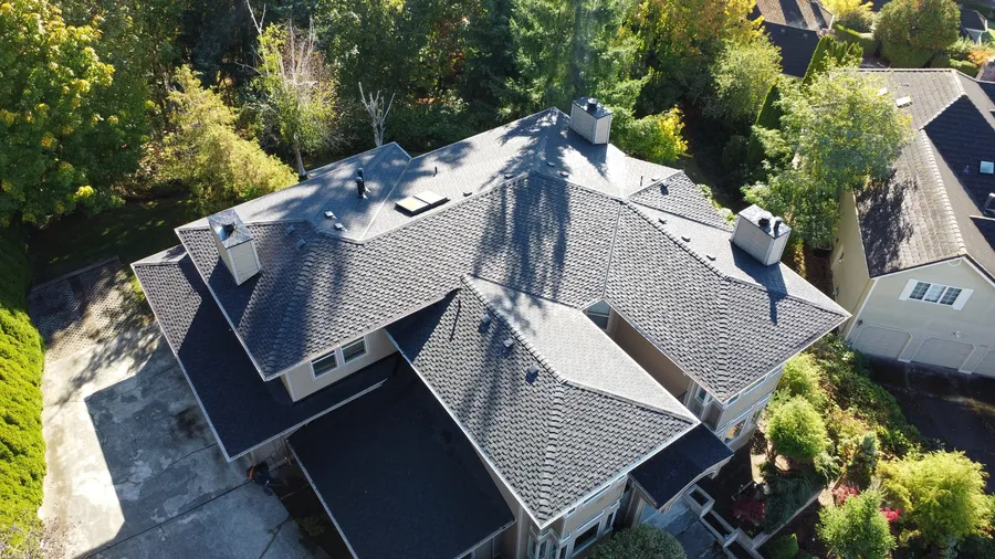 The same Bellevue home after: new charcoal architectural shingle roof