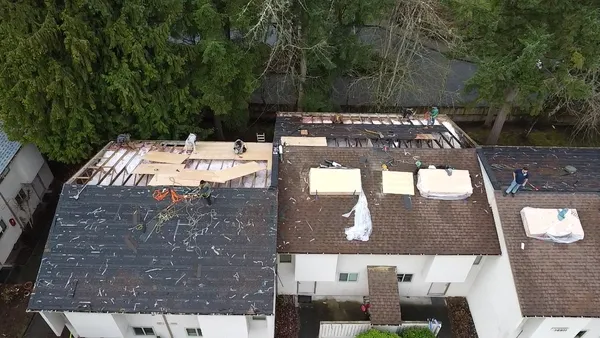 Rainier Repair Services crew restoring a storm-damaged roof in Bellevue, WA