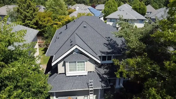 A completed architectural shingle roof on a home in Sammamish, WA